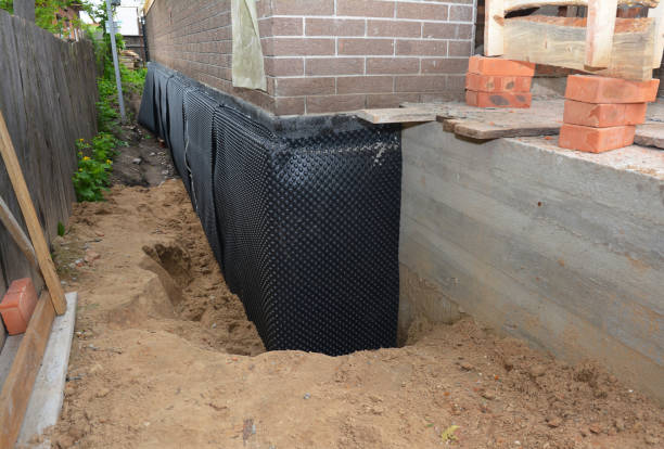 SJ Waterproofing Pros technician performing targeted Emergency Waterproofing assessment in Delphi, IN